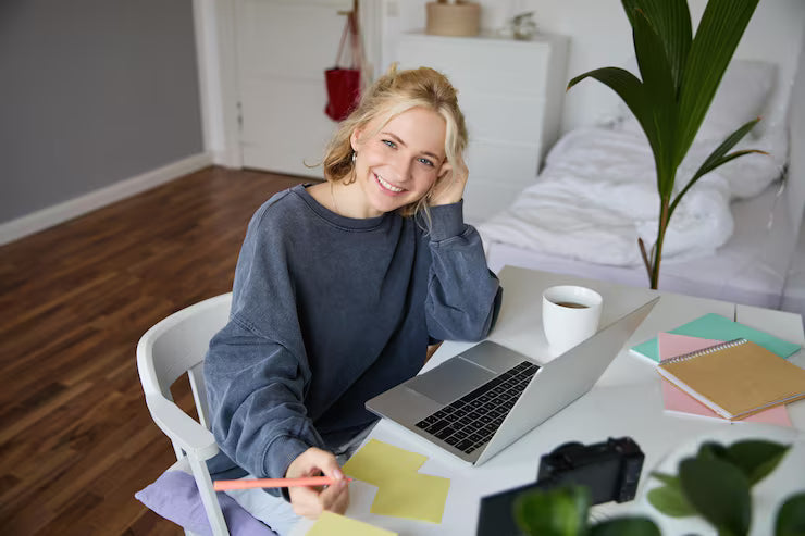 files/portrait-smiling-beautiful-blond-woman-writing-down-notes-doing-homework-studying-from-home-doing_1258-255042.avif